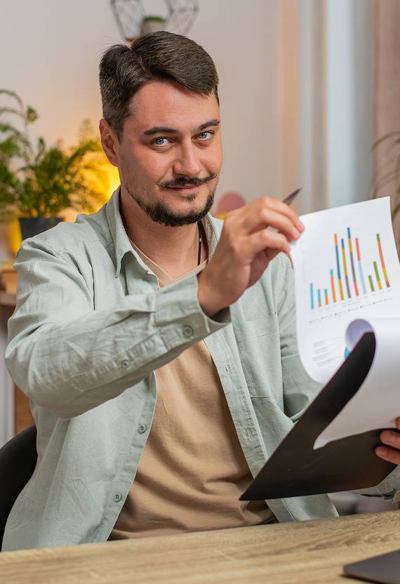 Learner reviewing financial literacy notes at a desk